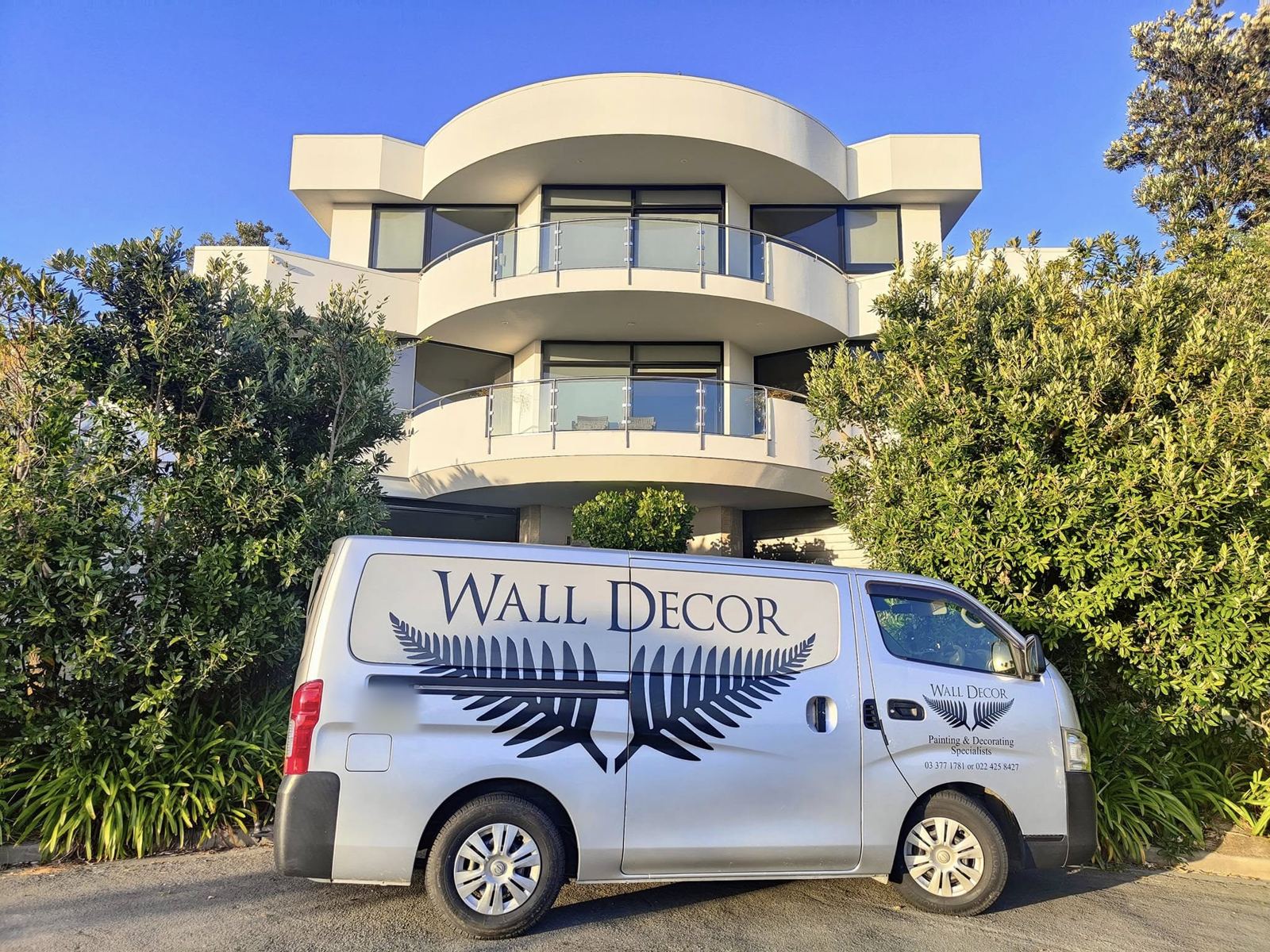 The Wall Decor van outside a finished home
